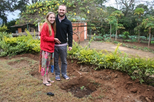 Ash and Sky planting trees at the Baby Home